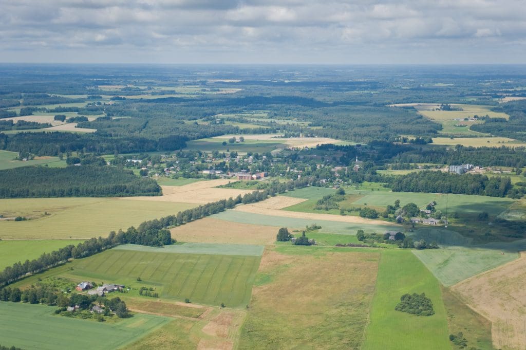 Aerial view of rural development land and farmland, illustrating valuation disputes in property negligence claims.