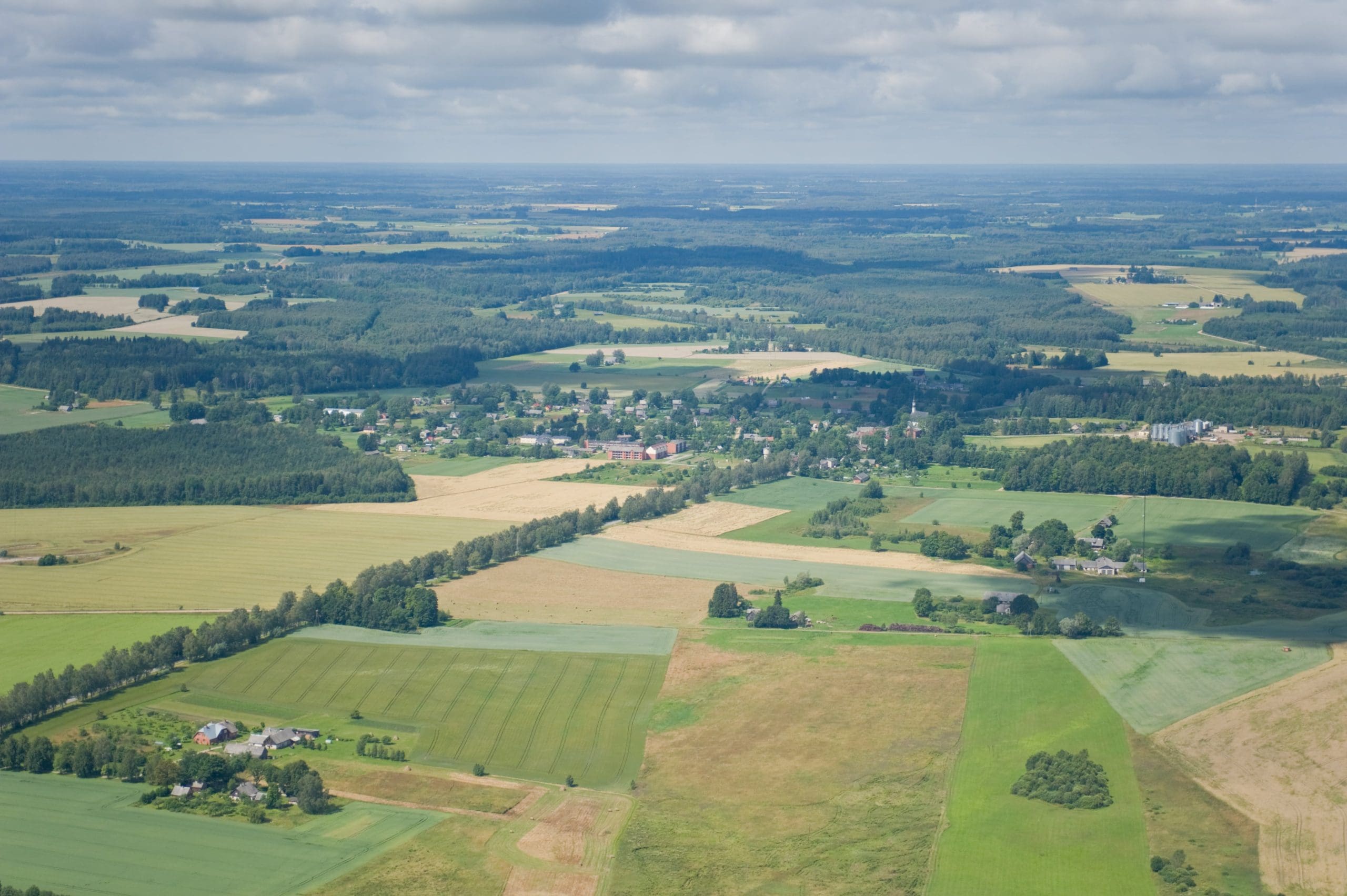 Aerial view of rural development land and farmland, illustrating valuation disputes in property negligence claims.